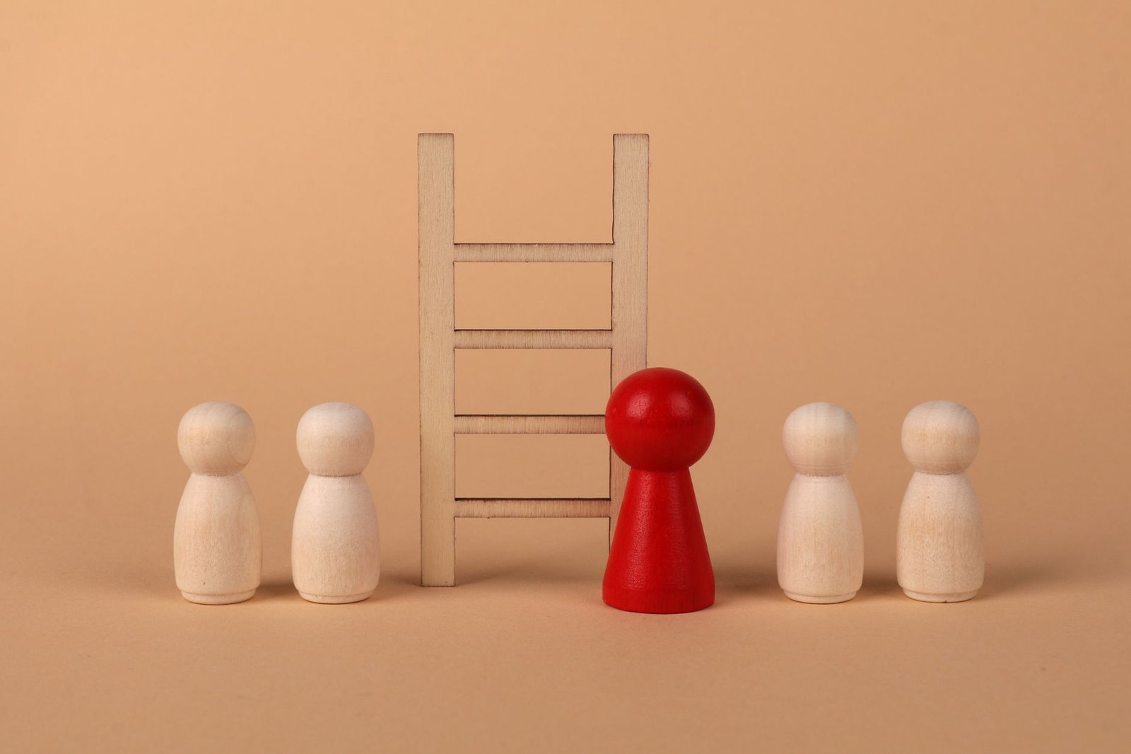 Wooden figures and a ladder representing career growth - AI skills for DBAs as the next professional step