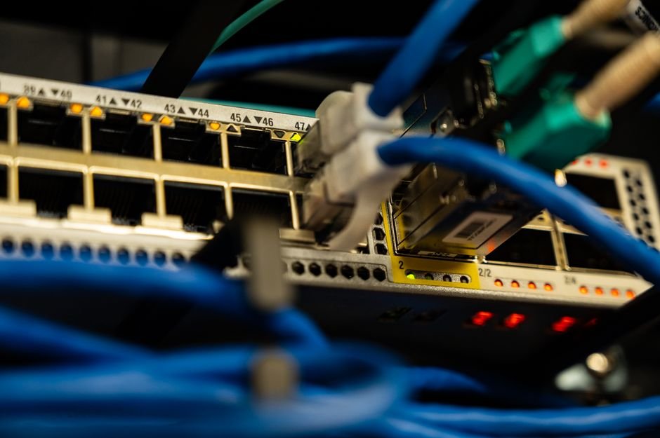 Ethernet cables plugged into a network switch - the network path behind Oracle TNS connections