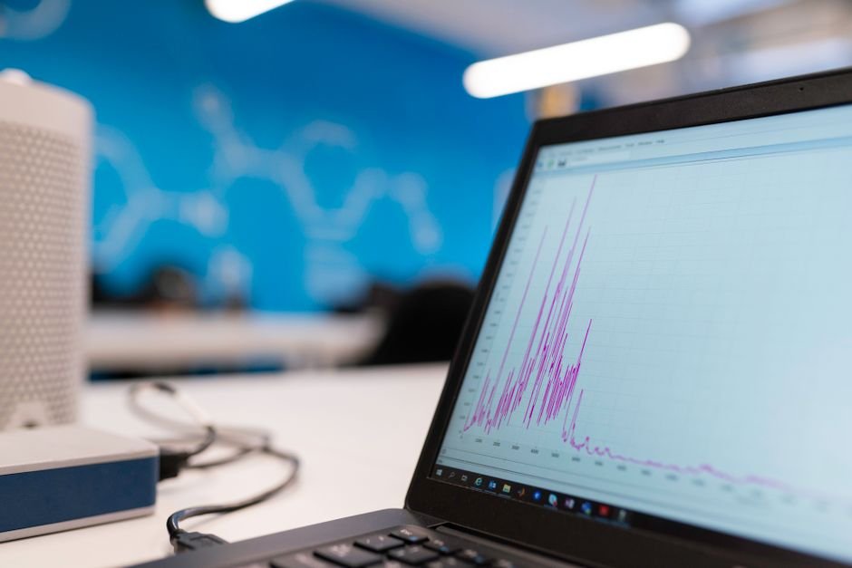 Laptop showing data analytics graphs - monitoring Oracle optimizer statistics in production