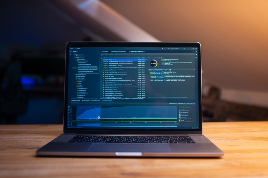 Laptop displaying code in a dim workspace - preparing an Oracle patching session with OPatch