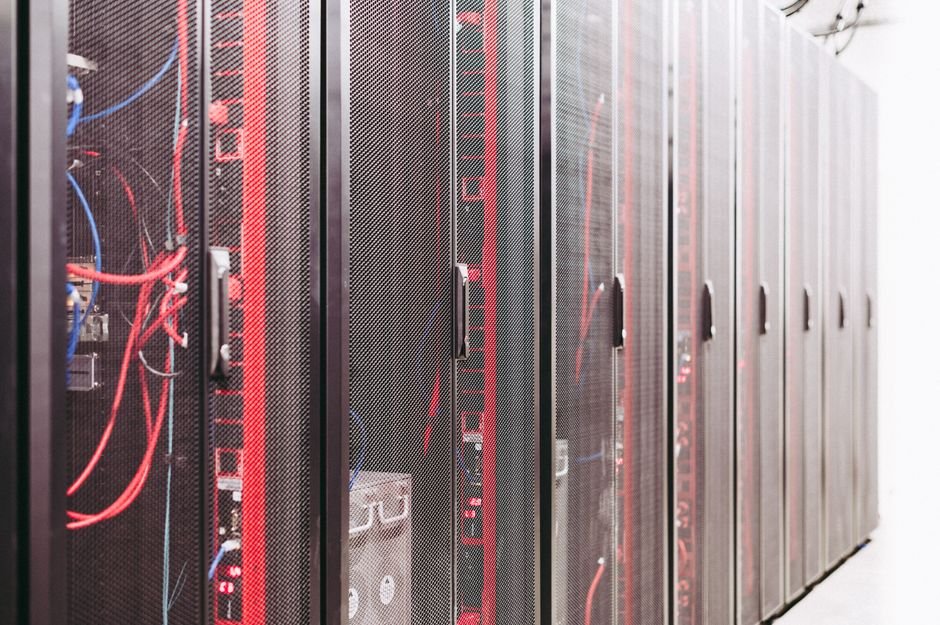 Server rack cabling in a data centre, the network plumbing behind an on-premise private LLM