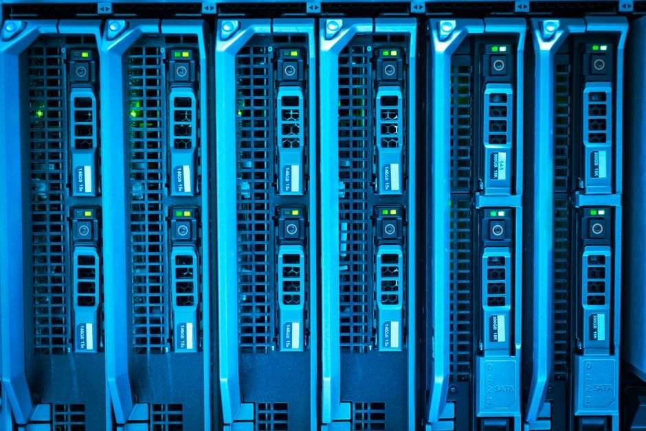 Rows of identical illuminated server racks representing RMAN DUPLICATE database clones
