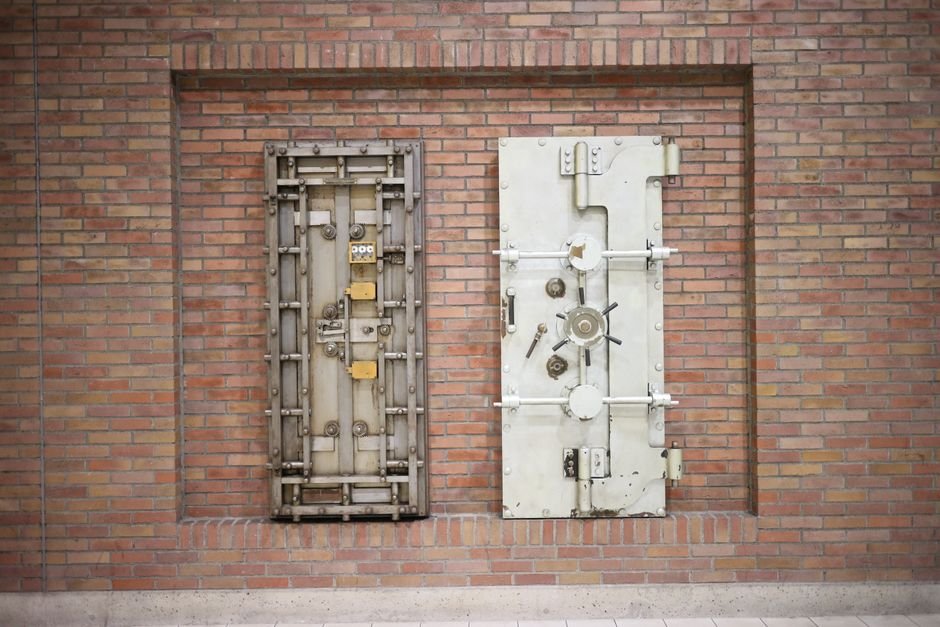 Steel vault doors symbolising Sovereign AI keeping regulated data locked inside your own environment