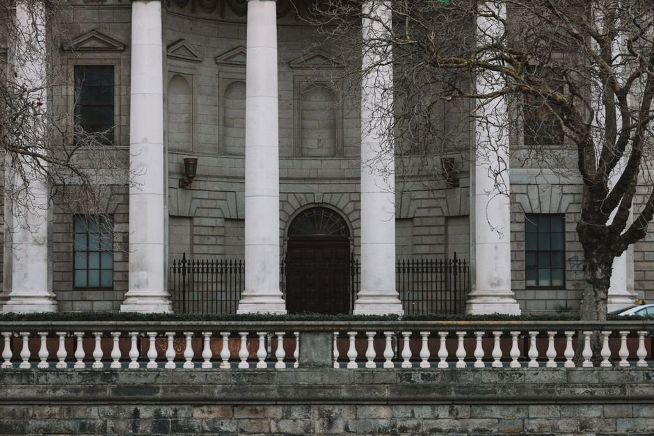 Courthouse columns representing the legal weight of AI data sovereignty and compliance rules