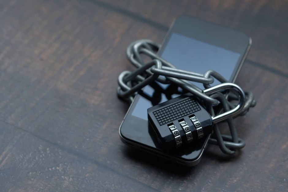 Smartphone wrapped in chain and padlock symbolising data protection and AI data sovereignty
